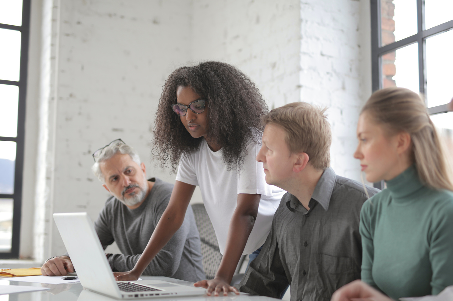 Diverse coworkers of different ages working in office